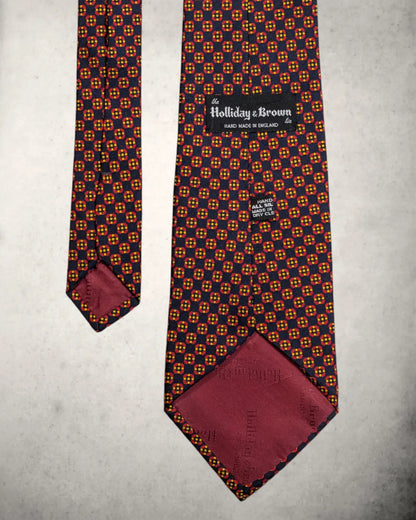 Handmade Seidenkrawatte von Holliday and Brown in rot blauem Foulard Muster